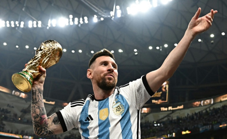 Lionel Messi holding up the World Cup trophy in 2022