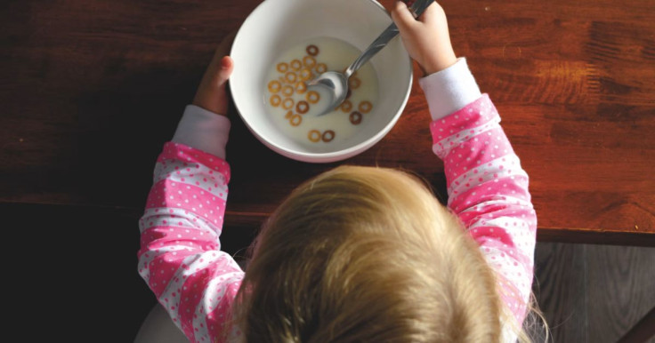 Baby Holding Food