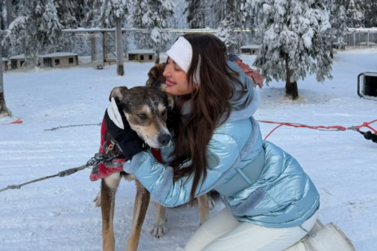 Kate Cassidy hugging Dog.