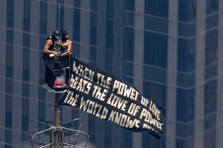 Two masked individuals climbed atop the Empire State Building