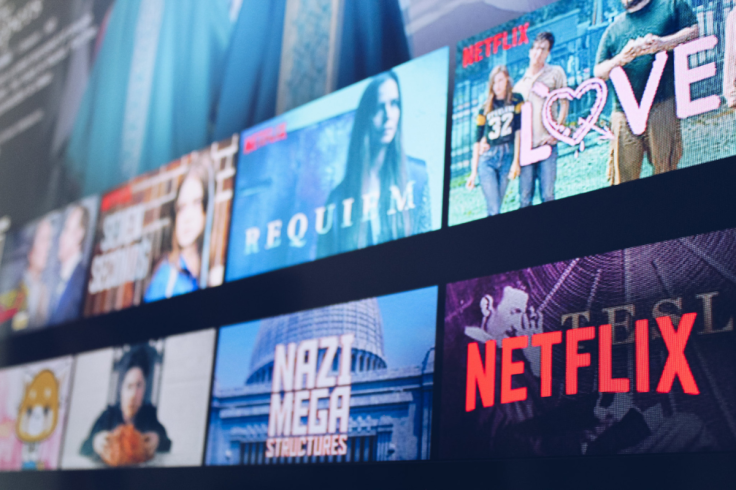 A Netflix content wall on a screen showing rows
