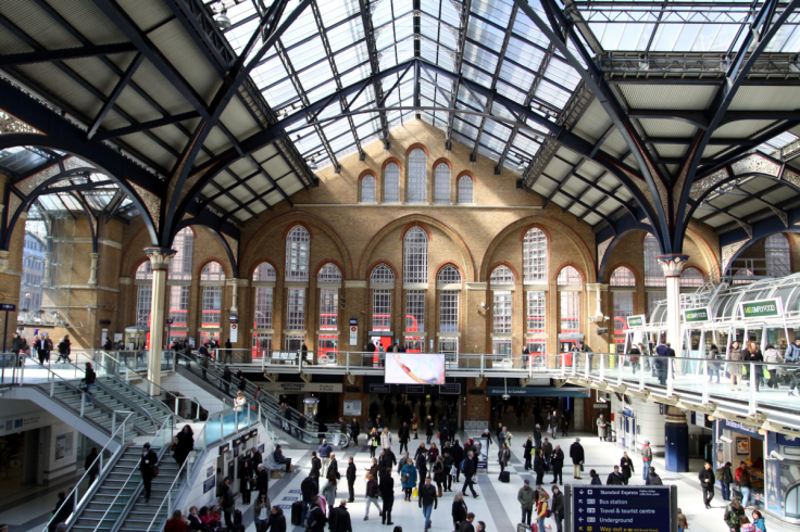 A wide interior view of the busy concourse at London