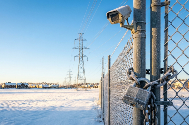 Photorealistic image of a frosted padlock on a substation gate
