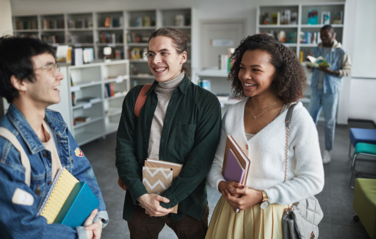 Group of students hanging out in the library