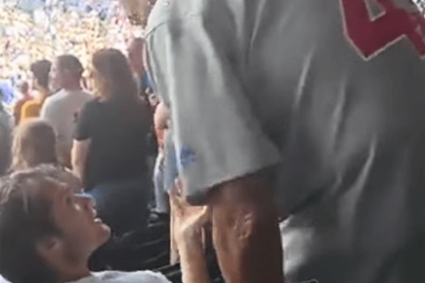 CUBS FAN SMACKED FOR NOT STANDING UP DURING NATIONAL ANTHEM