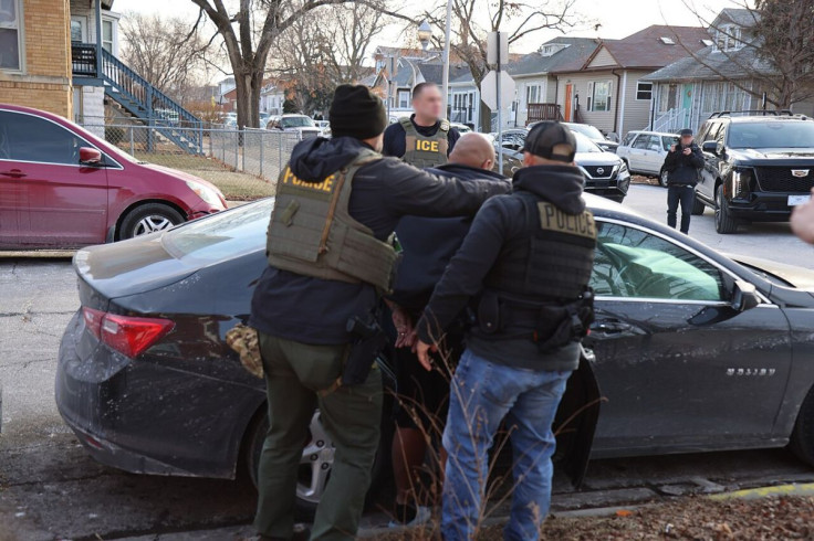 ICE Personnel Apprehending a Suspect