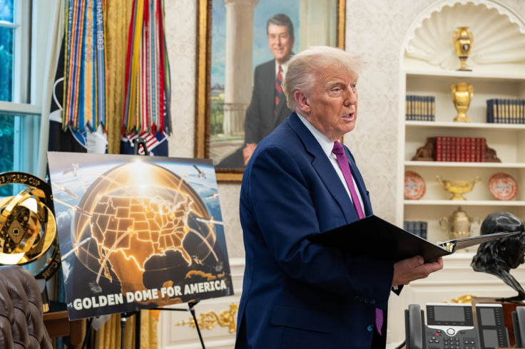 Donald Trump stands in the Oval Office