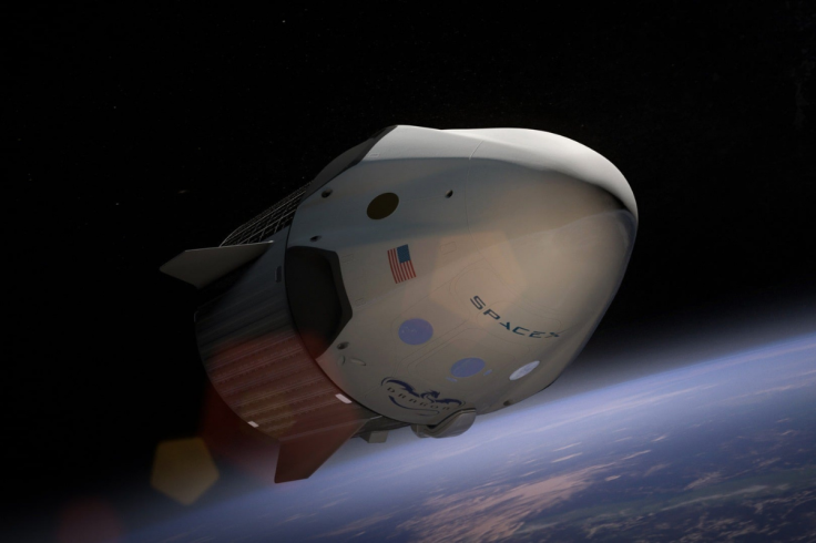 SpaceX Crew Dragon spacecraft orbiting Earth above the planet’s horizon