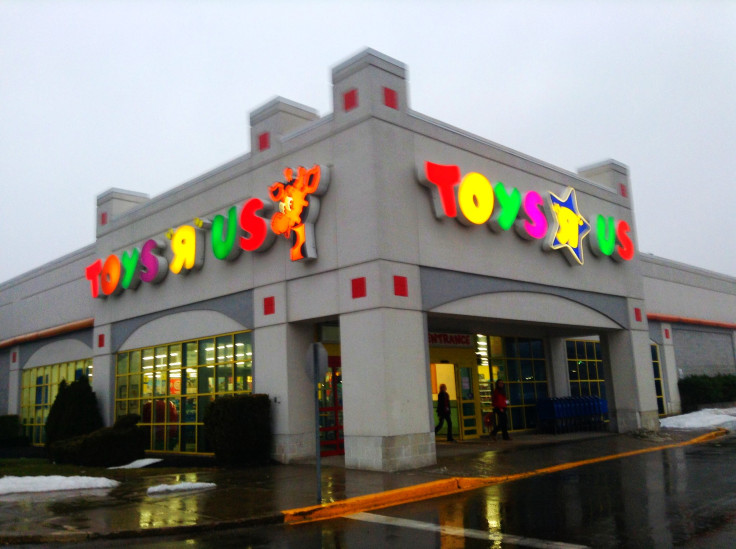 Toys 'R' Us lettering and giraffe mascot above a store