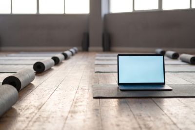Empty fitness studio with Laptop carrying the AI