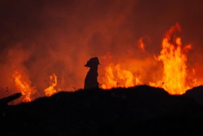 firefighter-in-front-of-massive-fire
