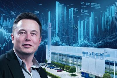 Elon Musk in front of the SpaceX factory building