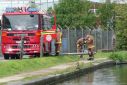 Firefighters near a canal in Birmingham