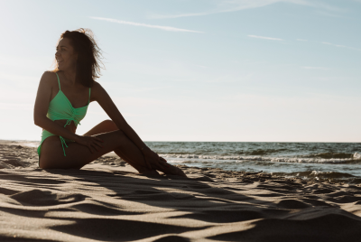 Young woman in a green swimsuit