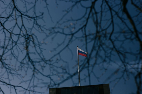 Russian-flag-sorrounded-by-branches