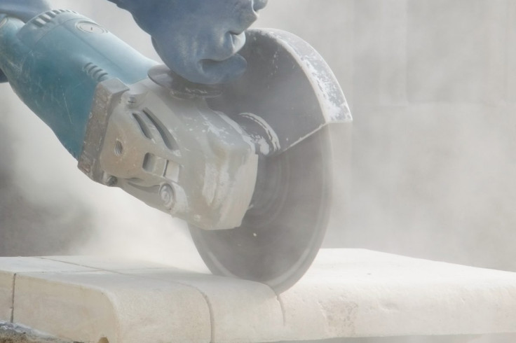 Worker Cutting Quartz Countertop With Silica Dust
