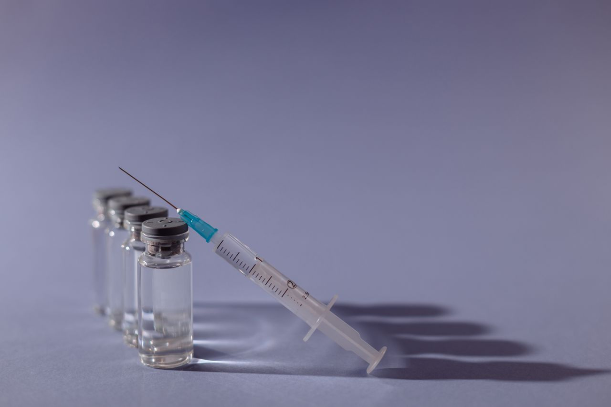 Vaccine vials and syringe