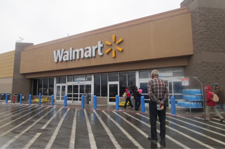 Walmart store with shoppers walking towards the entrance, senior citizen