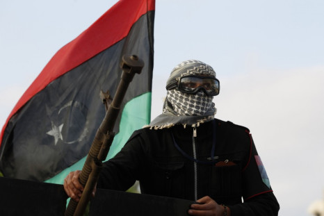 An anti-Gaddafi fighter returning from Sirte is welcomed in Misrata