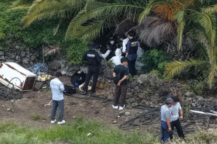 Police conducting a forensic examination at Jeju Island.