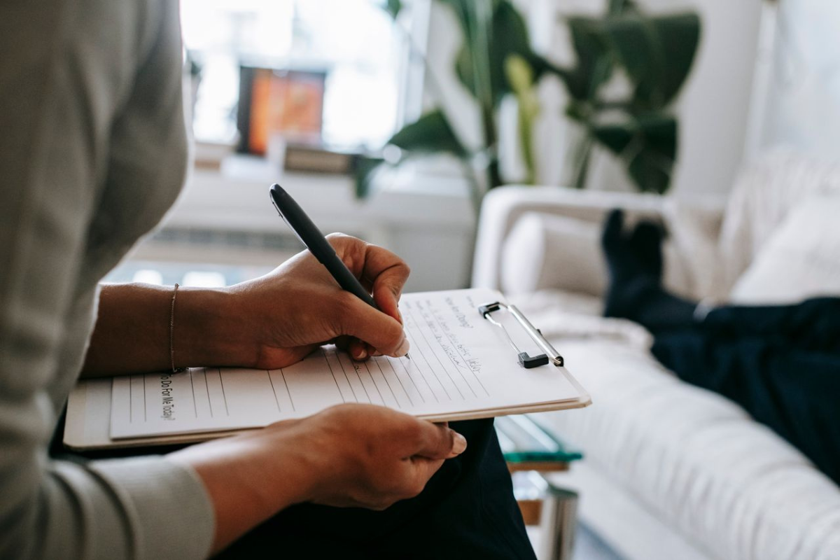 Representative photo of a therapist taking notes