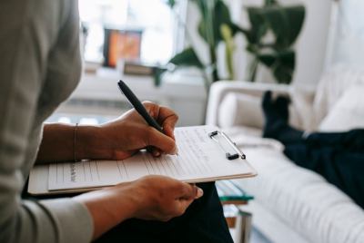 Representative photo of a therapist taking notes