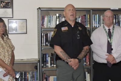 A school principal facing felony charges in West Virginia