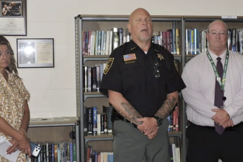 A school principal facing felony charges in West Virginia