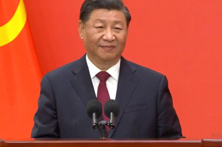 Xi Jinping against a red backdrop