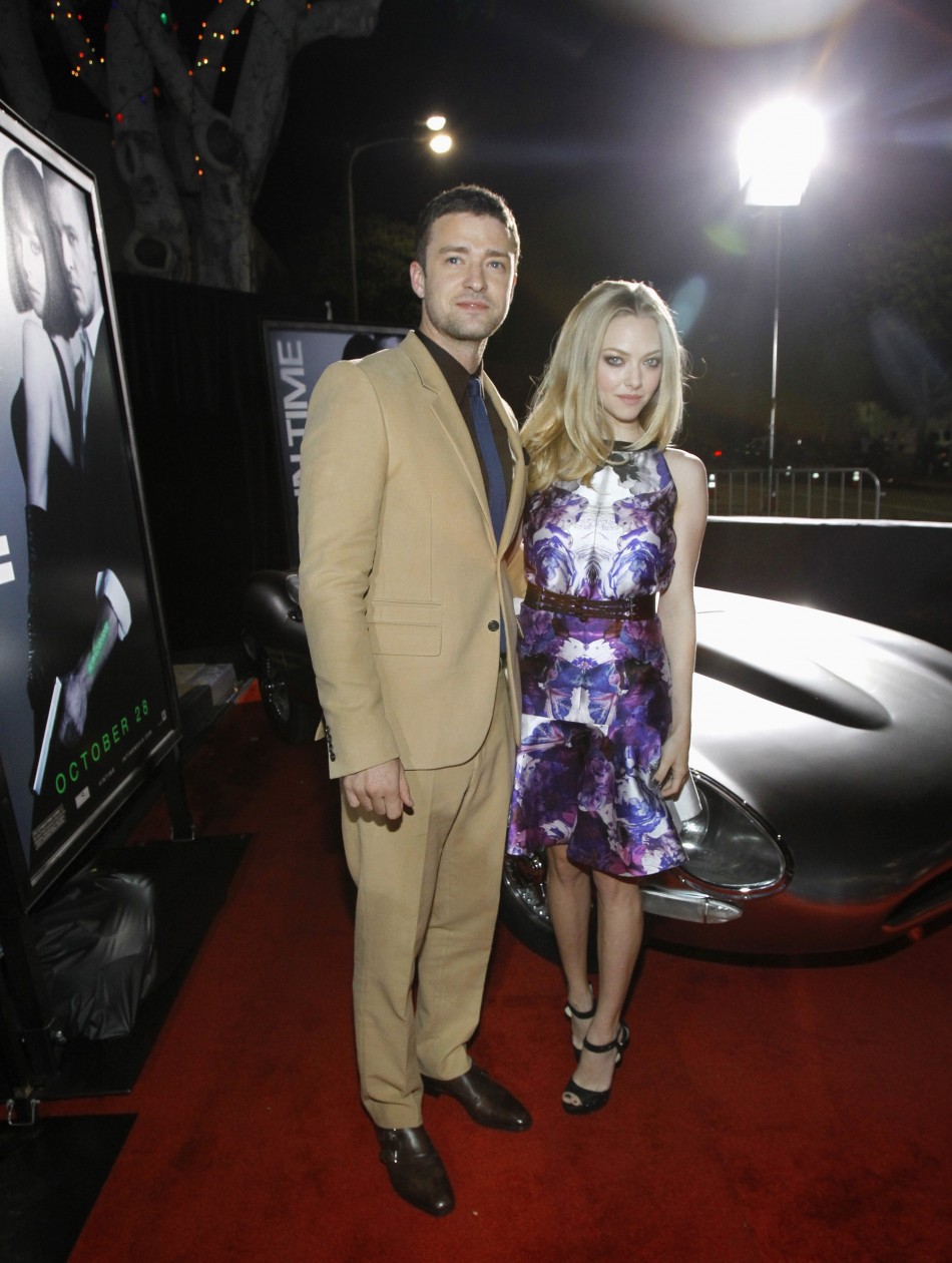 Cast members Justin Timberlake and Amanda Seyfried pose at the premiere of quotIn Timequot at the Regency Village Theatre in Westwood, California October 20, 2011. The movie opens in the U.S. on October 28.