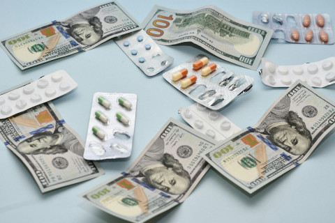 Medicine and Dollars Side by Side