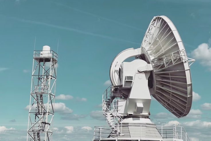 white parabolic satellite dish antenna
