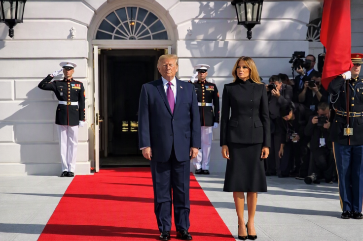 Trump’s red-carpet walk sparks debate over movement and Melania’s position.