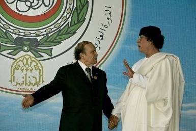 Algerian President Abdelaziz Bouteflika talks to Libya&#039;s Muammar Gaddafi  ...