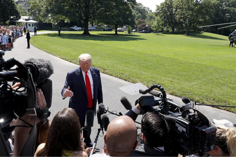 President Donald J. Trump talks to reporters