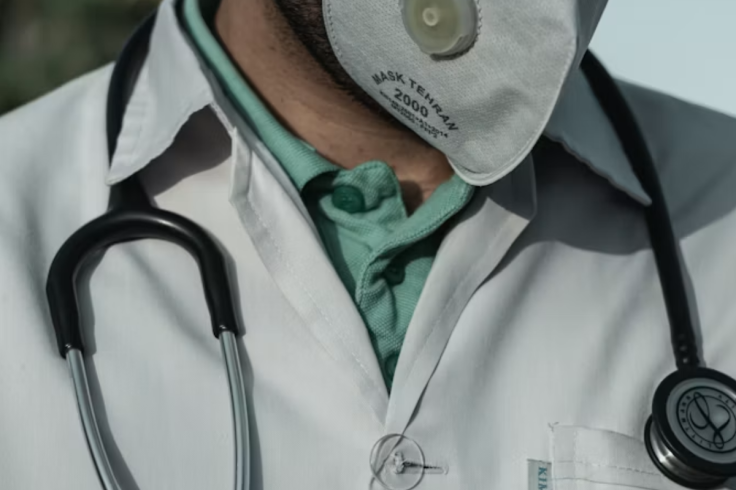 person in white and black stethoscope