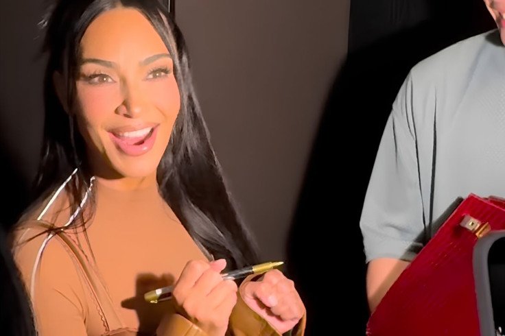 Kim Kardashian Hesitates Before Signing Fan’s Rare Crocodile Birkin
