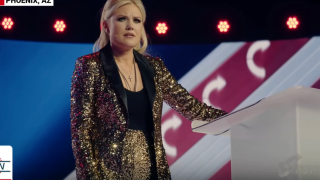 Erika Kirk’s Gold Suit at AmericaFest 2025