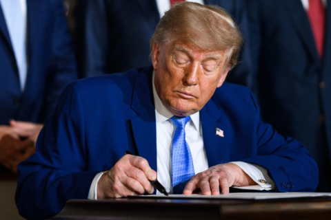 Trump signing a document