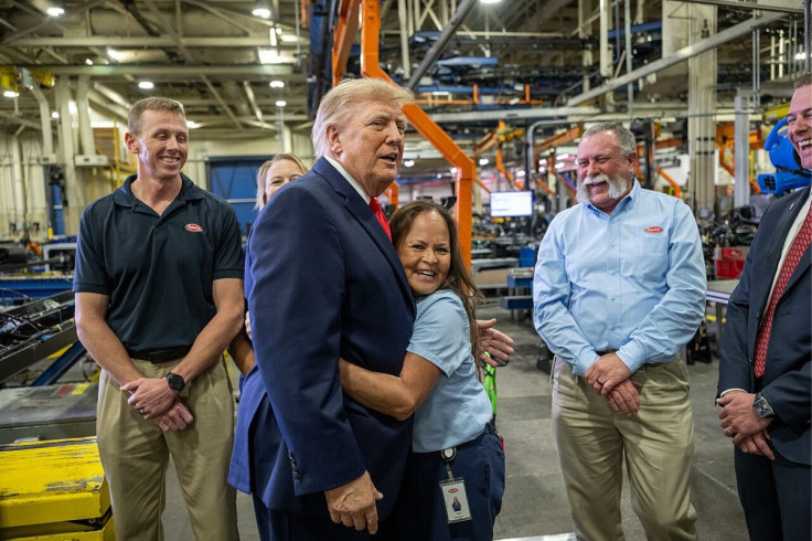 Donald Trump WIth a Supporter During a Visit