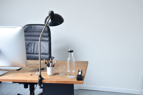 Office desk with water bottle