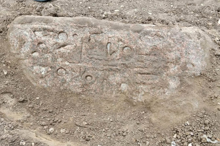 Carved stone block bearing inscriptions