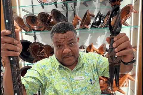 Shopkeeper showing cannibalism tools