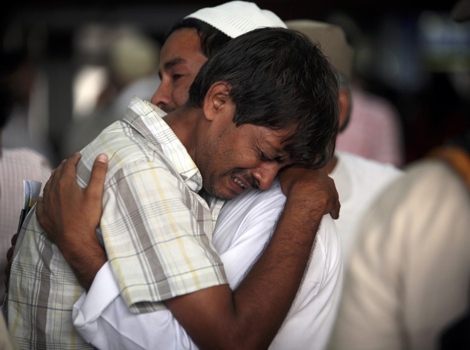 Hajj pilgrims cry as they prepare to depart for Mecca from the Tribhuvan International Airport in Kathmandu 18102011