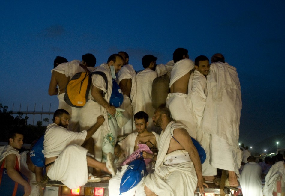 Muslim pilgrims catch a ride on a truck from the plains of Arafat outside the holy city of Mecca to Muzdalifa during the haj pilgrimage