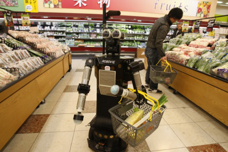 Robot named "Robovie-II" moves around at a grocery store during shopping assisting experiment in Kyoto, western Japan