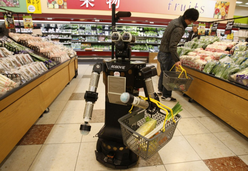 Robot named &quot;Robovie-II&quot; moves around at a grocery store during shopping assisting experiment in Kyoto, western Japan