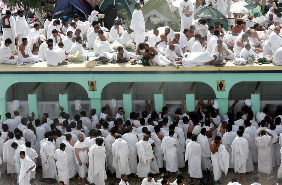 Muslim pilgrims queue to wash themselves before prayer in Arafat near Mecca.