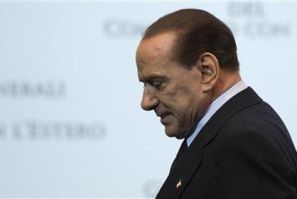 Italy Prime Minister Silvio Berlusconi leaves at the end of a meeting in Rome
