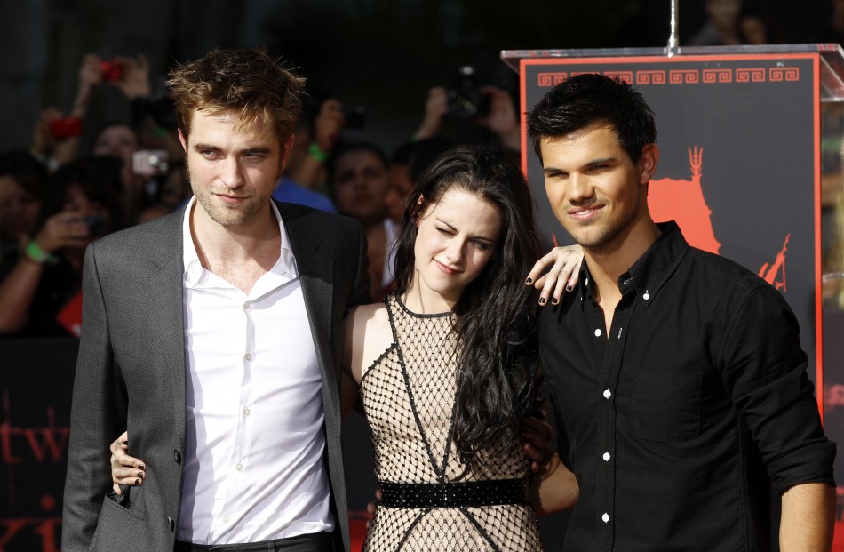 Actors Robert Pattinson left, Kristen Stewart and Taylor Lautner pose at their hand and footprint ceremony at the Grauman039s Chinese Theatre in Hollywood, California November 3, 2011.